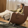 A woman lying back in the Bodyfriend Familie massage chair.