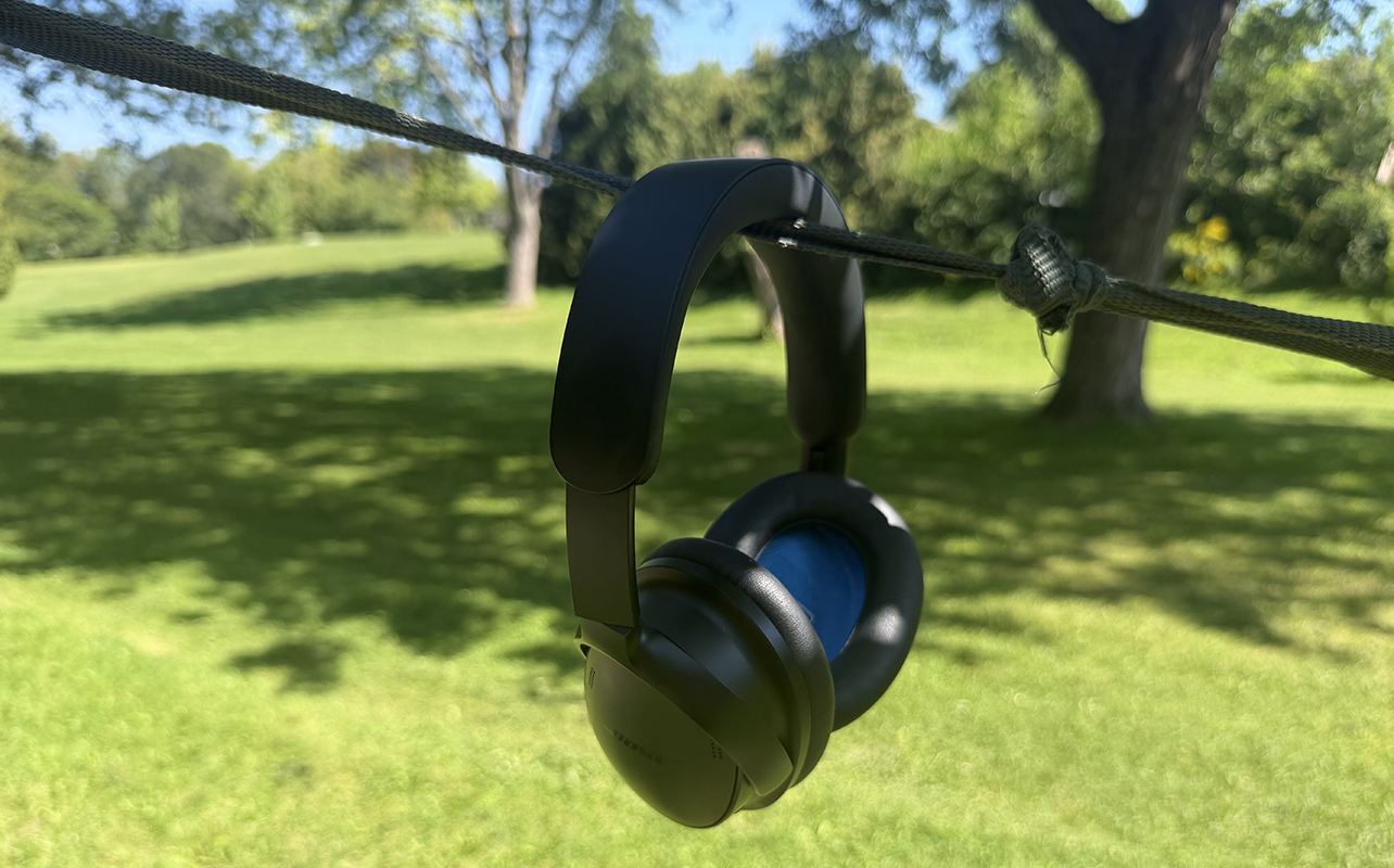 The Bose QuietComfort 2 headphones hanging outside. 