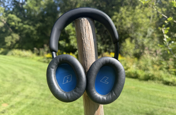 The Bose QuietComfort 2 headphones outside mounted on a pole showing the insides of the earcups.