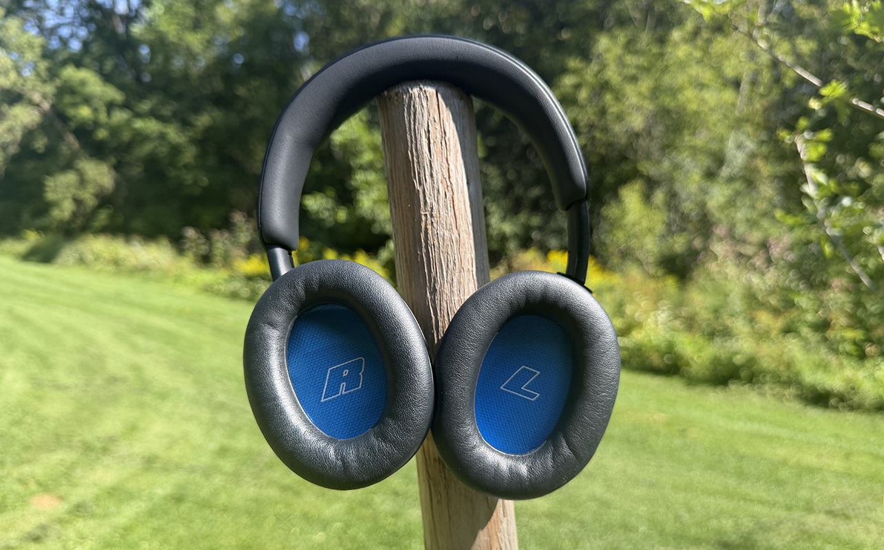 The Bose QuietComfort 2 headphones outside mounted on a pole showing the insides of the earcups.