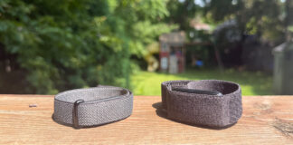 Fitbit Air and Garmin CIRQA side by side on a ledge outside.