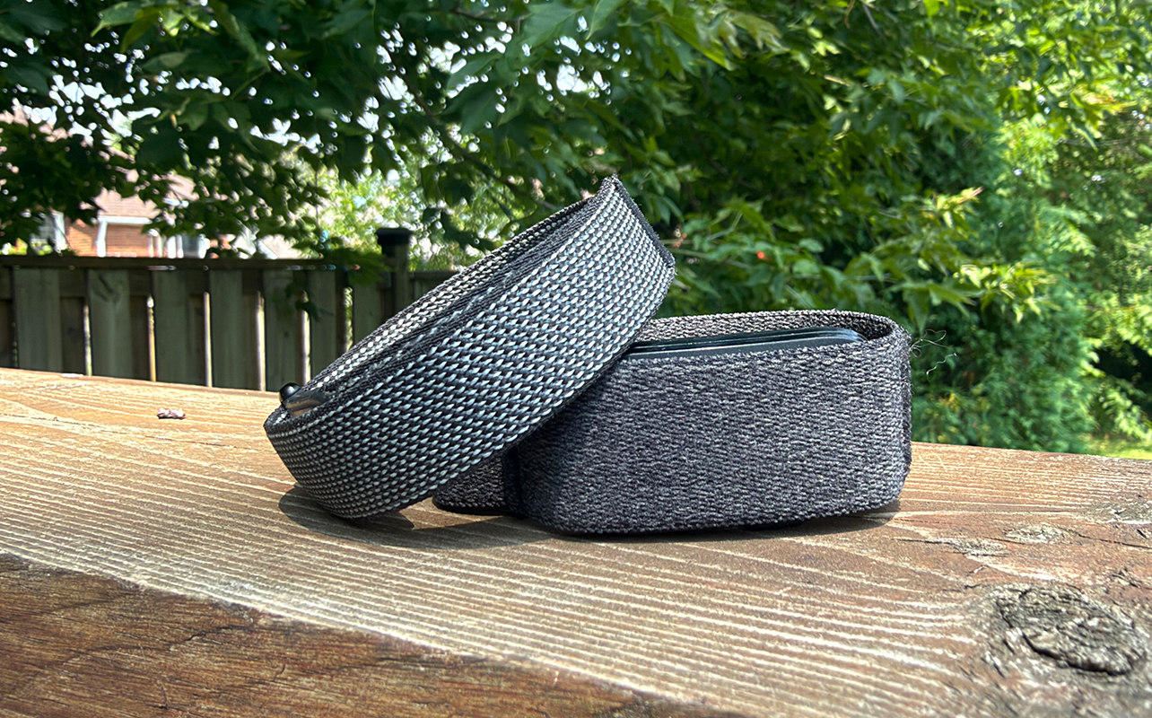 Fitbit Air atop the Garmin CIRQA on a ledge outside.