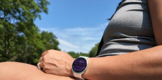 Samsung Galaxy Watch 9 on a wrist resting on a leg outside.