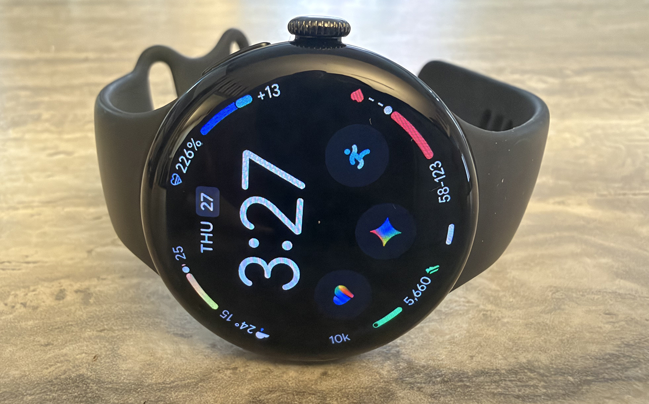 A Google Pixel Watch 5 on its side on a counter.