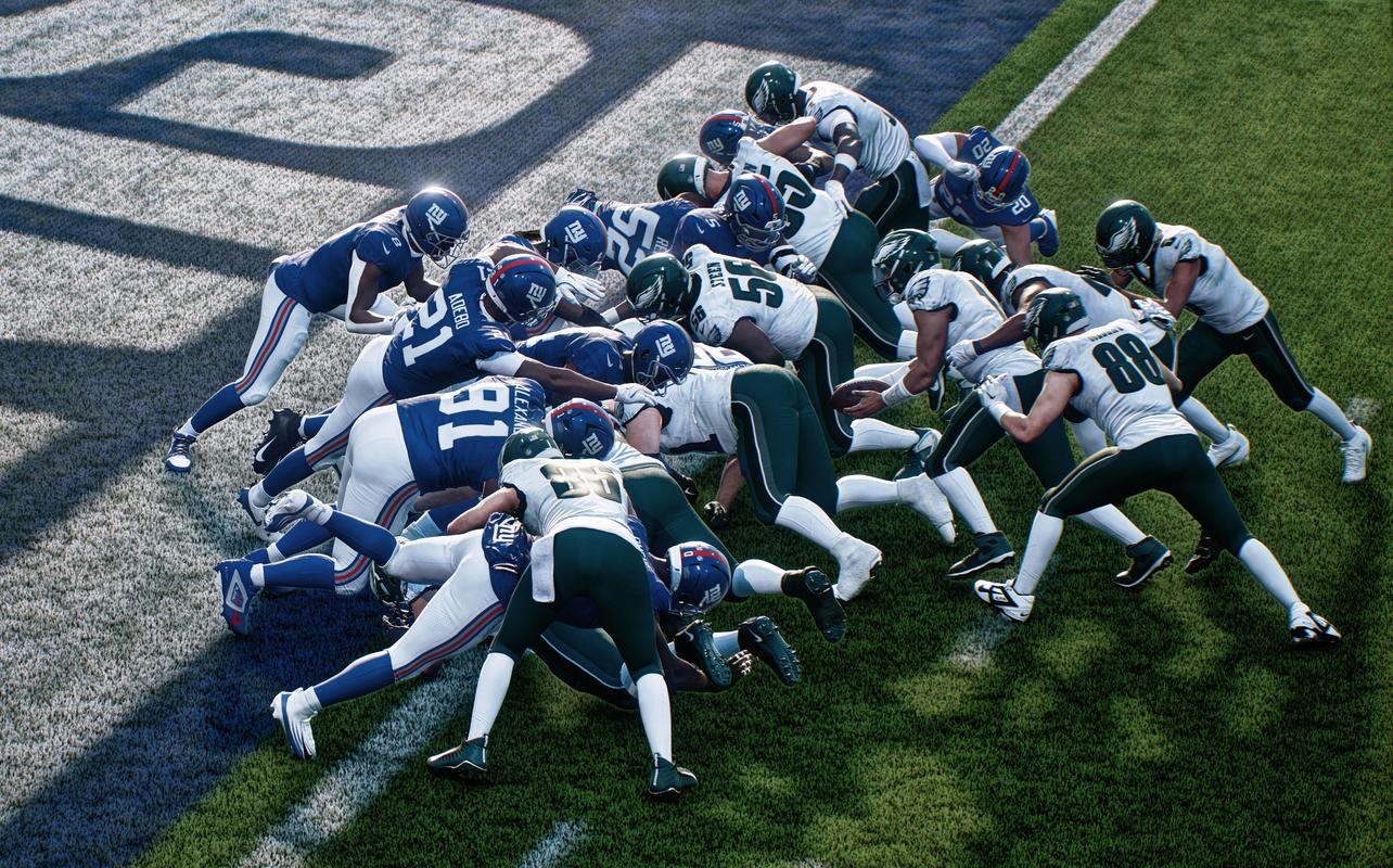 Madden NFL 27 gameplay showing defenders stopping a short-yardage play near the goal line.