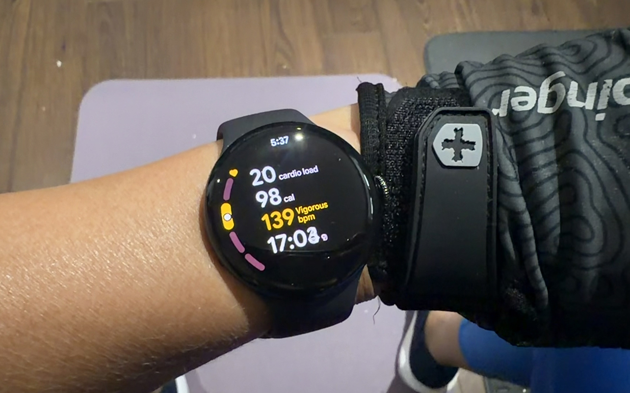 A Google Pixel Watch 5 showing active workout tracking.