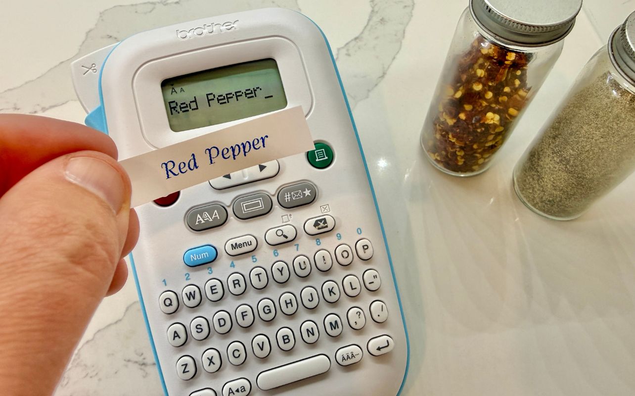 A close-up of the Brother P-touch with the word Red Pepper on screen and the label with Red Pepper written on it.