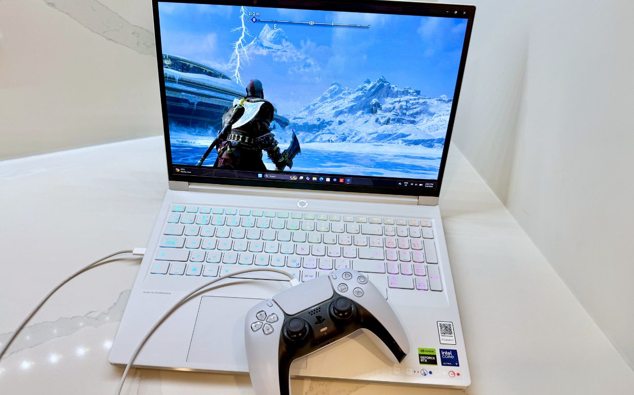 A PS5 DualSense controller and PC connected via USB cable.