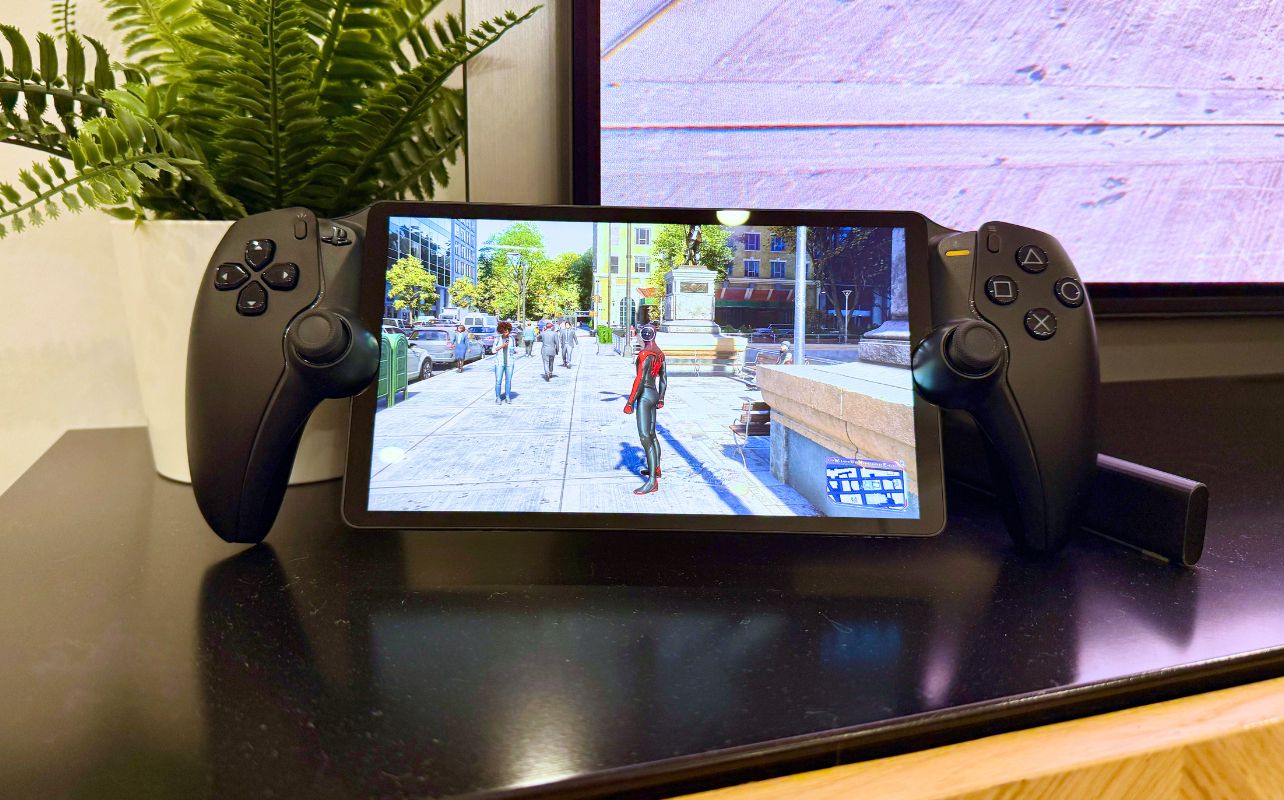 The PlayStation Portal is displaying Spider-Man 2 next to a green plant and a TV screen.