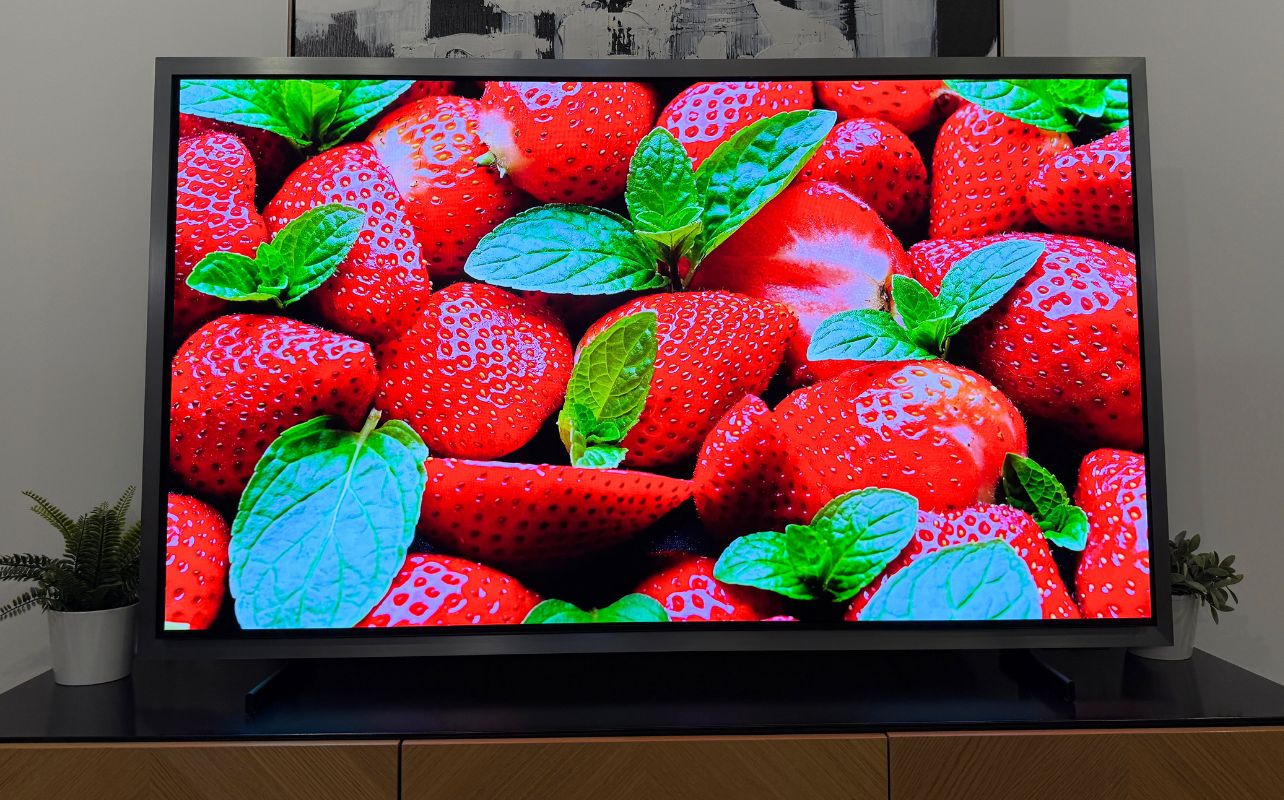 Samsung S95H image with strawberries on screen.
