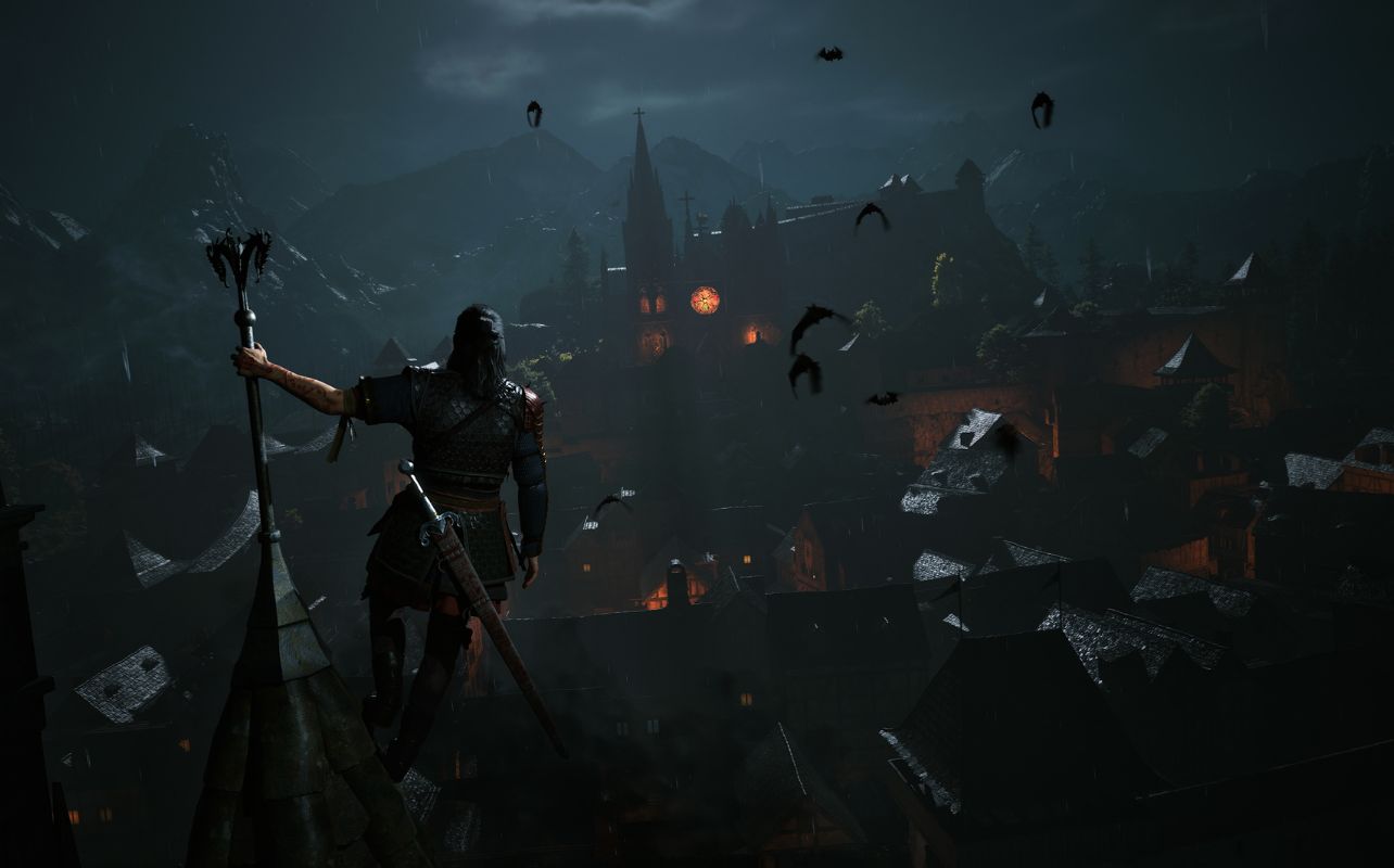 A picture of the lead character, Coen, from The Blood of the Dawnwalker on a rooftop overlooking a medieval town.