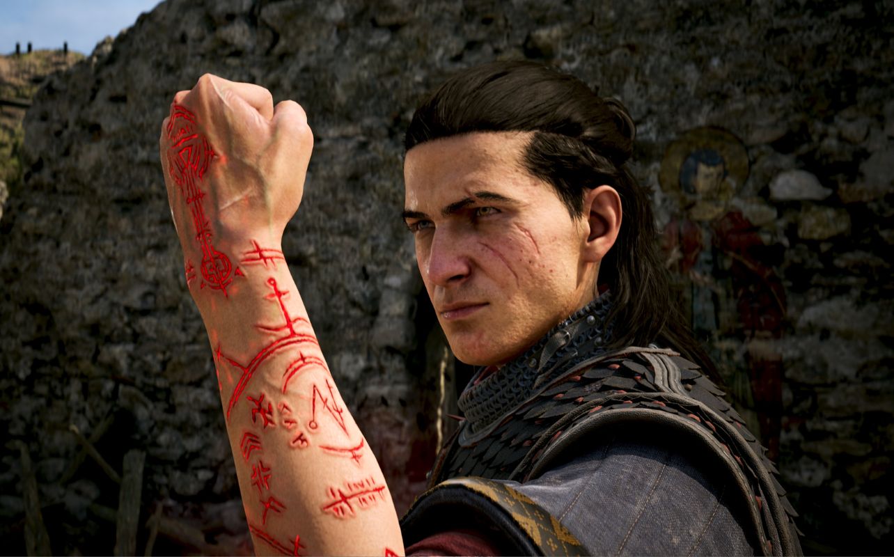 A picture of the lead character, Coen, from The Blood of the Dawnwalker with marks on his forearm.