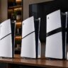 PS5 Slim Digital Edition, PS5 Slim and PS5 Pro consoles displayed with a DualSense wireless controller in a living room setup.