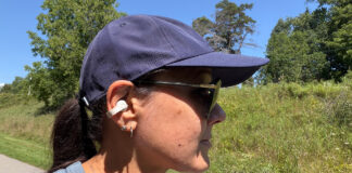 A woman wearing the Sennheiser Accentum Clip buds on a trail.