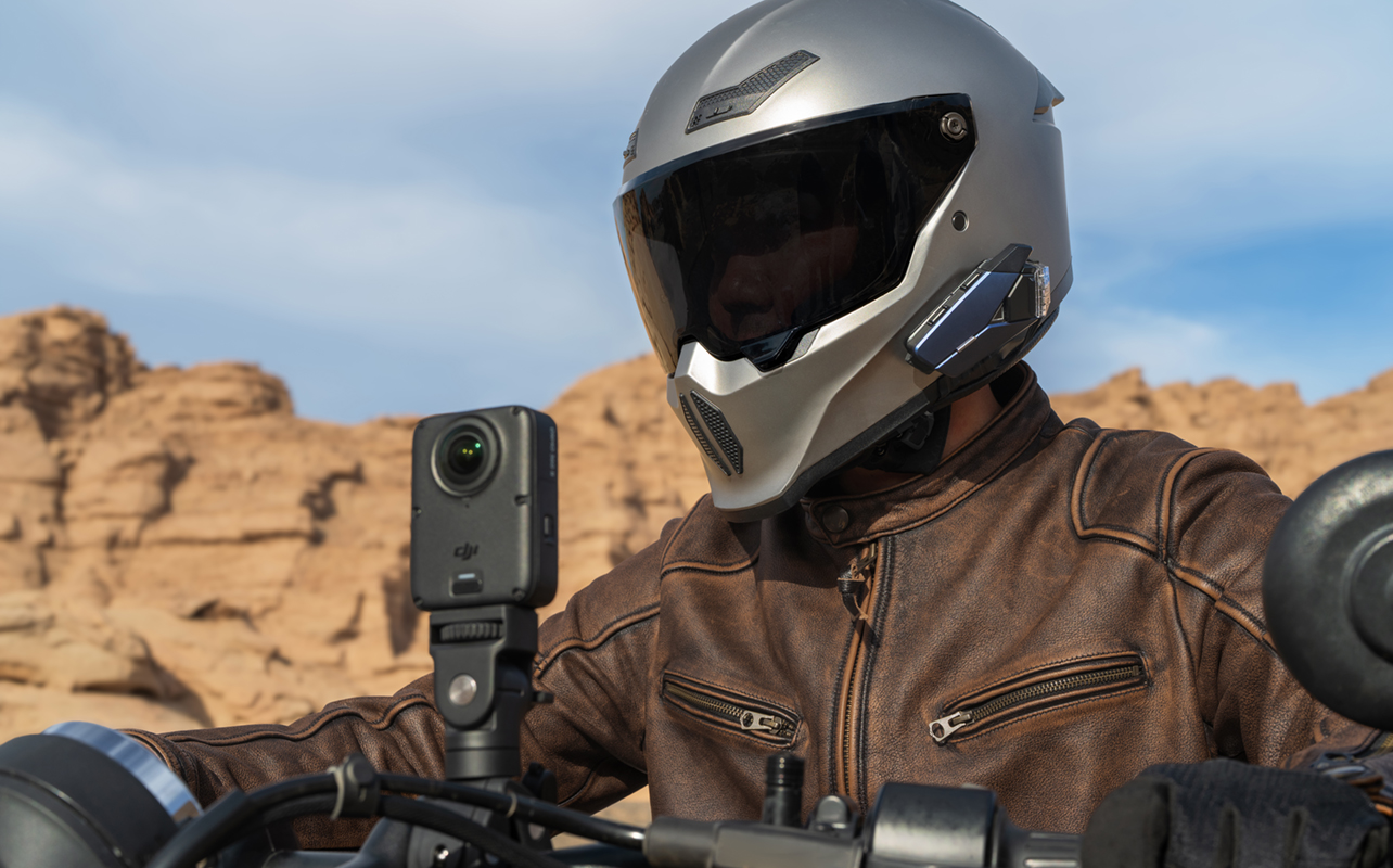 Man on motorcycle with DJI Osmo 360 II mounted up front.