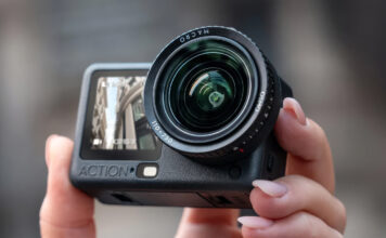 Close-up of person holding DJI Osmo Action 6 in hand.