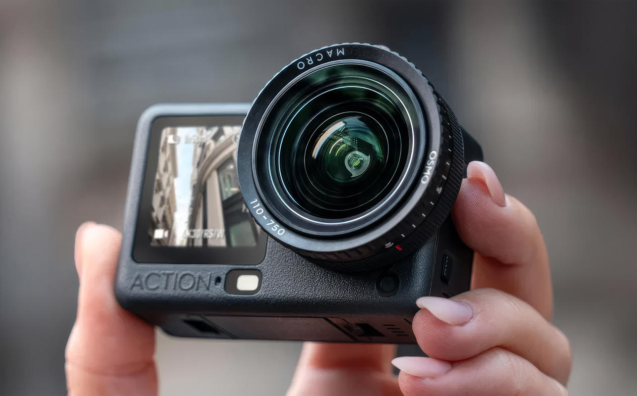 Close-up of person holding DJI Osmo Action 6 in hand.