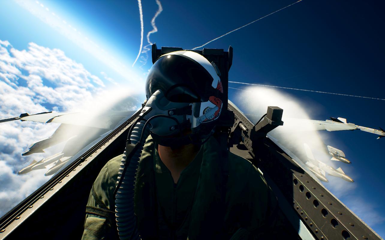 Ace Combat 8: Wings of Theve pilot seated in a fighter jet cockpit above the clouds with aircraft flying nearby.
