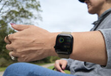A woman holding her arm out with the Apple Watch Series 12.