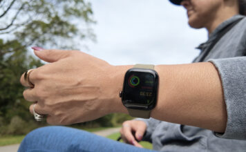 A woman holding her arm out with the Apple Watch Series 12.