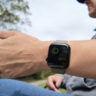 A woman holding her arm out with the Apple Watch Series 12.