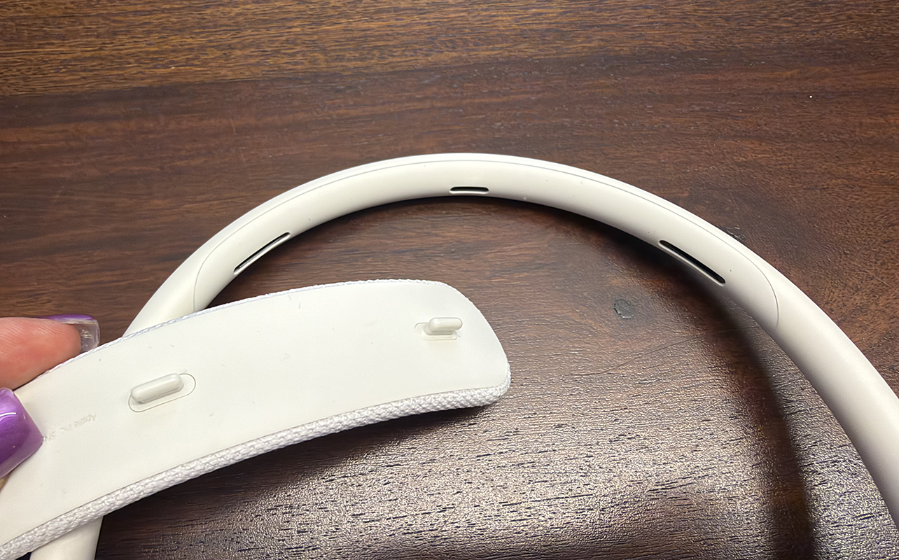 A close-up of the headband cushion showing how to click it into place.